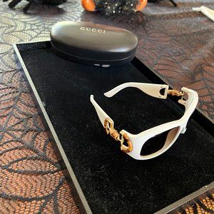 Gucci Sunglasses - White with gold accents on the side.